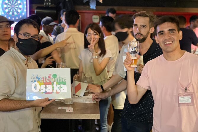 3Hour Osaka Pub Crawl Bar Hopping Nightlife Guided Tour in Namba - Stop 2: Kanemasa Liquor Store and standing okonomiyaki culture