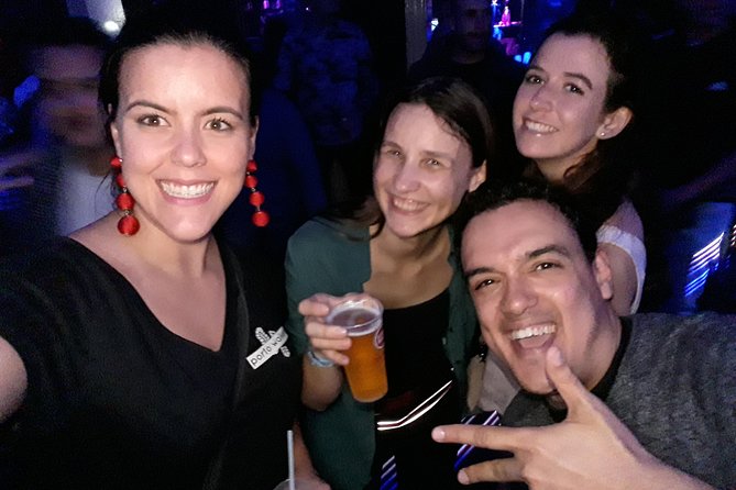 4-hour Guided Porto Pub Crawl with 6 drinks and VIP CLUBentry - Meeting Point at Fonte dos Leões: The Red Umbrella Trick