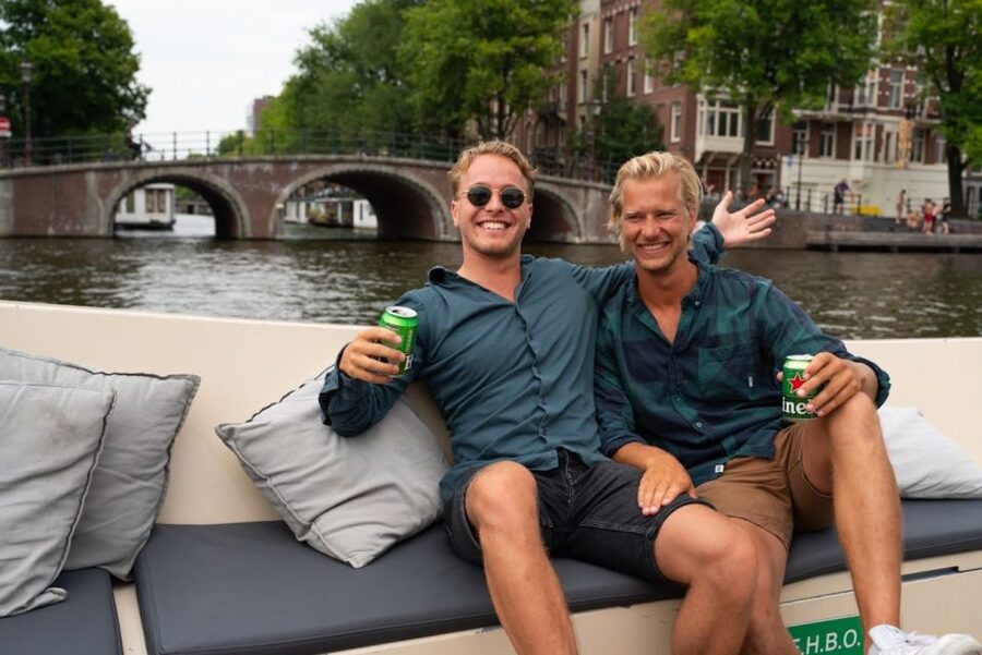 Amsterdam: Red-Light District Pub Crawl and Booze Boat Tour - Meeting points and timing: the two-part check-in