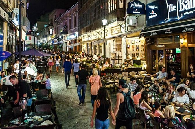 Bucharest Private Old Town Pub and Bar Crawl with Guide - Stop 1 in Lipscani: Palinca shots, a lively start, and a possible rooftop break