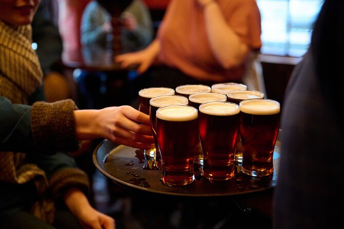 Devour London Historical Pub Tour:Traditional British Food & Ales - Stop 2: The Old Bell Tavern near Covent Garden with sausage roll and cider