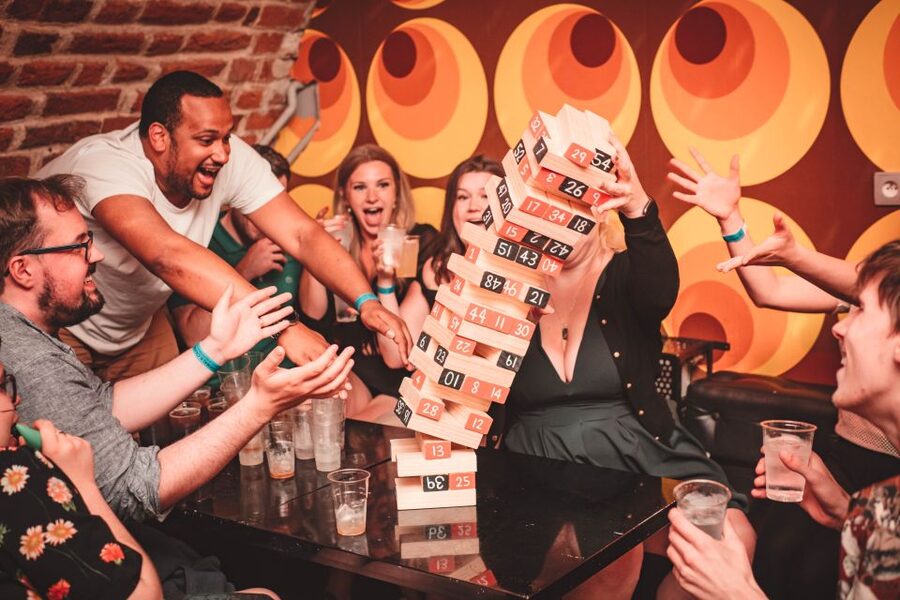 Krakow: Pub Crawl with 1 Hour of Unlimited Alcoholic Drinks - St. Wojciech Church Meeting Point and the Red-and-Black Umbrella