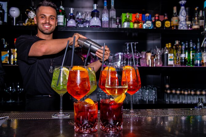 Lisbon Pub Crawl Walking Tour with Drinks Included - Guides and group vibe: up to 30 people and a social mission